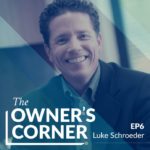 A person with short, curly hair is smiling while wearing a dark blazer. Text on the image reads "The Owner's Corner EP6 Luke Schroeder." The background has a blue overlay with diagonal stripes, highlighting Luke Schroeder.