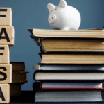 A piggy bank sits atop a stack of books on the right, while wooden blocks on the left spell out "FAFSA" vertically. The background is neutral, contrasting with the books and blocks, hinting at upcoming FAFSA changes.