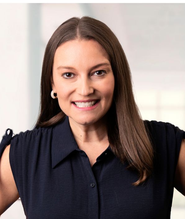 lady with straight long brown hair smiling