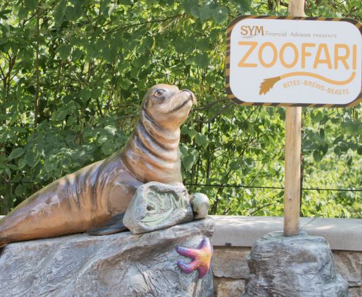 a seal with Fort Wayne Zoofari sign