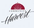 Logo with the text "Community Harvest." Above the text, there is a maroon semi-circle with stylized images of grains or wheat growing from its center. The word "Harvest" is written in elegant, cursive script.