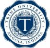 Blue and white seal for Trine University in Angola, Indiana, featuring a large "T" in the center surrounded by a laurel wreath. The university name and location encircle the emblem.