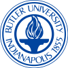 A circular blue emblem denoting "Butler University" at the top and "Indianapolis 1855" at the bottom. In the center, there is a stylized flame above a pedestal.