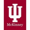 The image shows the logo of Indiana University McKinney School of Law. It features a white stylized "IU" monogram on a red background with the word "McKinney" in white capital letters below it.