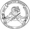 Circular logo of the Army Mountain Warfare School. The center features a ram's head with mountains in the background, crossed ice axes and a sword. The words "Army Mountain Warfare School" are inscribed along the top and "April 1983" along the bottom.