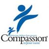 A logo featuring a stylized blue figure with outstretched arms and legs. Below it, a smaller similar figure appears. Text reads: "Releasing children from poverty. Compassion in Jesus' name.