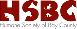 Logo for the Humane Society of Bay County featuring the initials "HSBC" in large red letters with silhouettes of various animals (dog, cat, rabbit, and bird) integrated into the letters. The full name, "Humane Society of Bay County," is written below in grey text.