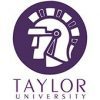 The image depicts the logo of Taylor University. It features a stylized profile of a Trojan helmet within a circle, all in a dark purple color. Below the helmet, the text "Taylor University" is written in bold, purple uppercase letters.
